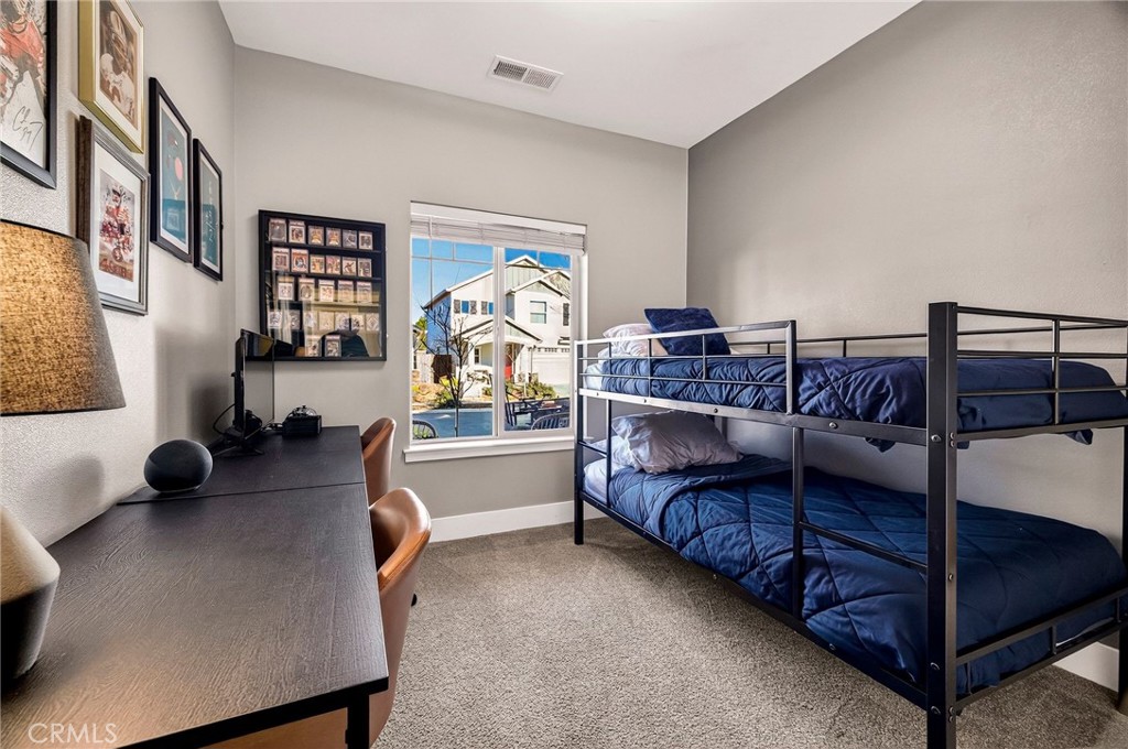 2855 Pin Oak Lane Chico, CA 95928 - Photo 23 of 48 a bedroom with furniture and a large window