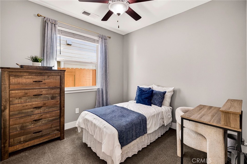 2855 Pin Oak Lane Chico, CA 95928 - Photo 29 of 48 a bedroom with a bed and a dresser