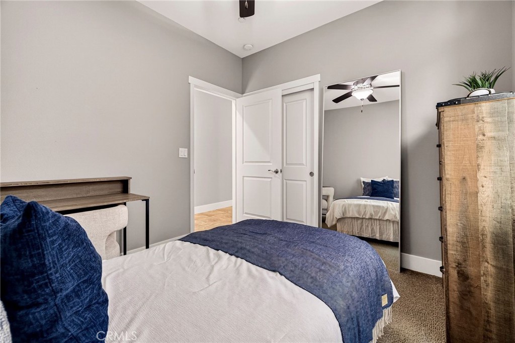 2855 Pin Oak Lane Chico, CA 95928 - Photo 30 of 48 a bedroom with a bed and a mirror