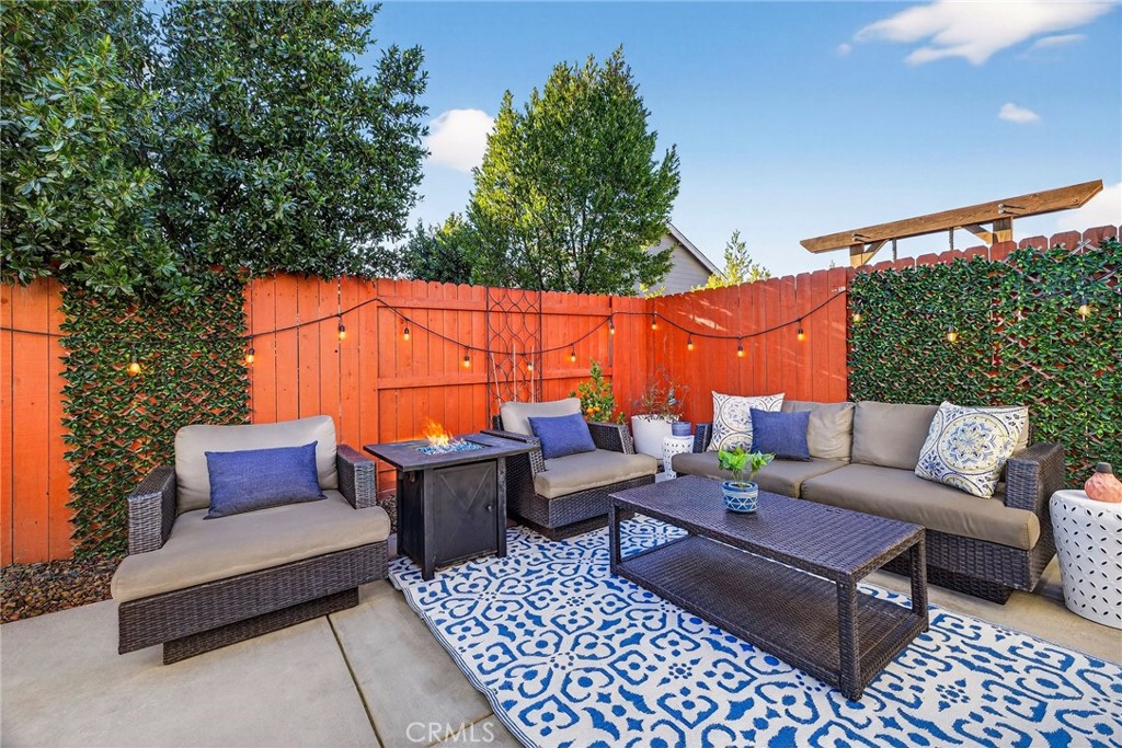 2855 Pin Oak Lane Chico, CA 95928 - Photo 6 of 48 a outdoor sitting area with furniture and a rug
