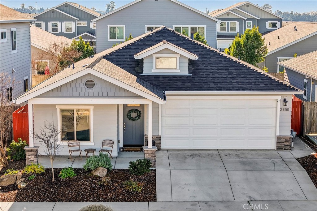 2855 Pin Oak Lane Chico, CA 95928 - Photo 8 of 48 a front view of a house with garden
