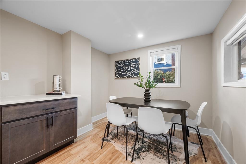 106 44th Street Pittsburgh, PA 15201 - Photo 12 of 41 a view of a dining room with furniture and wooden floor