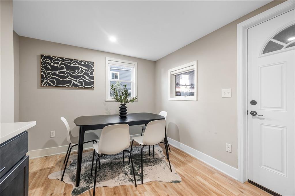 106 44th Street Pittsburgh, PA 15201 - Photo 13 of 41 a view of a dining room with furniture and wooden floor