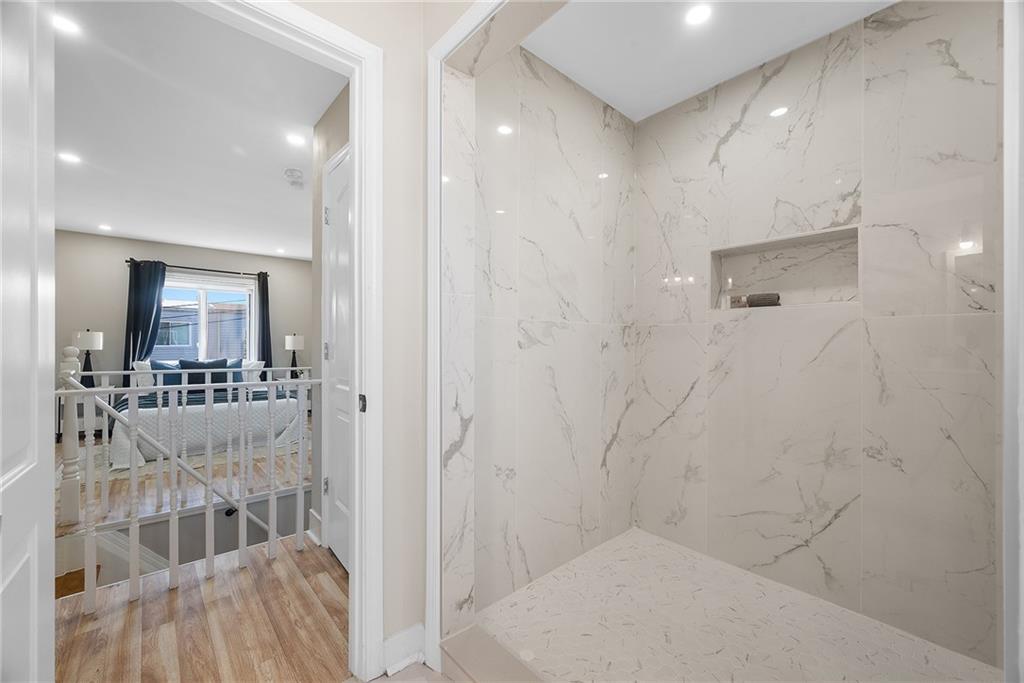 106 44th Street Pittsburgh, PA 15201 - Photo 19 of 41 a bathroom with a glass door shower