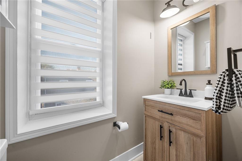 106 44th Street Pittsburgh, PA 15201 - Photo 28 of 41 a bathroom with a sink vanity and a mirror
