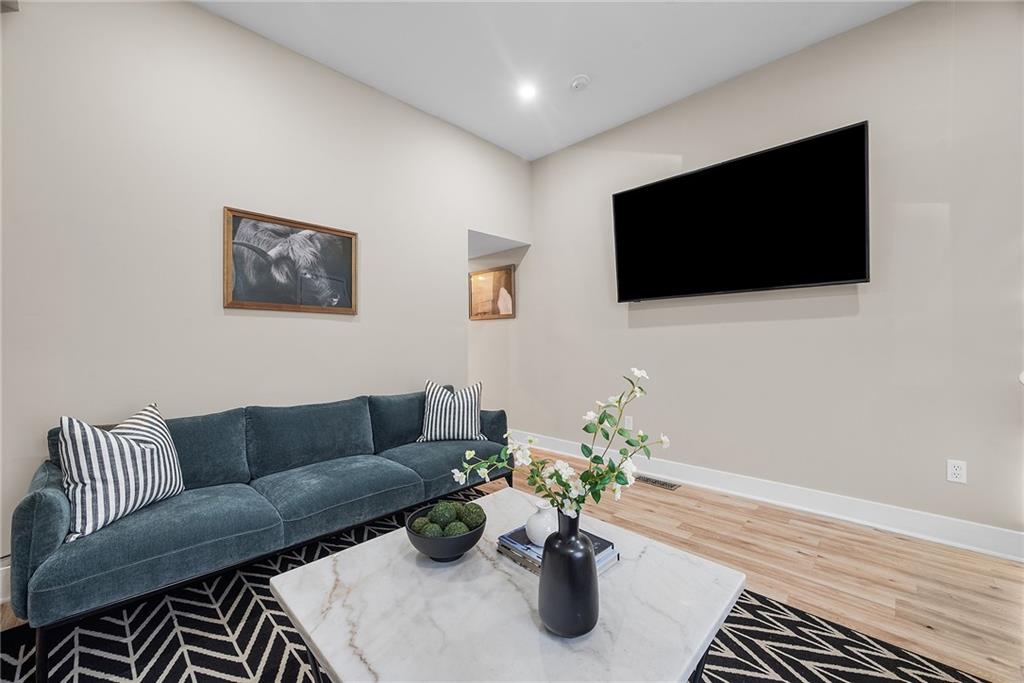 106 44th Street Pittsburgh, PA 15201 - Photo 5 of 41 a living room with furniture and a flat screen tv
