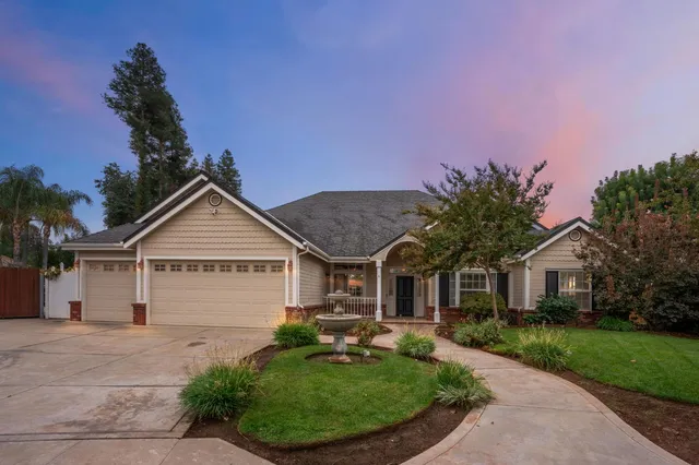 front view of a house with a garden