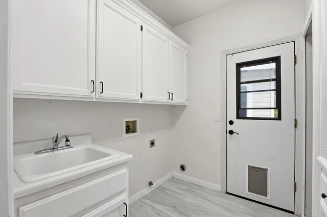 a bathroom with a sink and cabinets