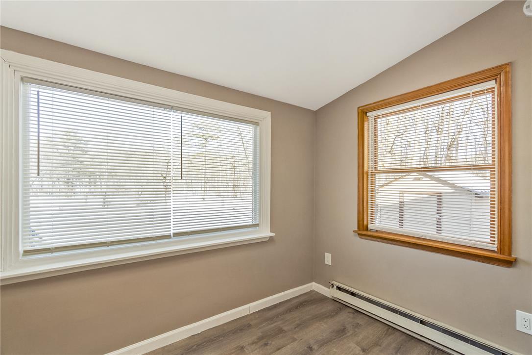 121 Short Ridge Road Albrightsville, PA 18210 - Photo 24 of 35 Dual aspect windows frame peaceful wooded views in this versatile room with durable laminate flooring.