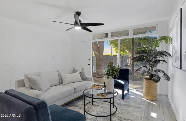 a living room with furniture and a large window