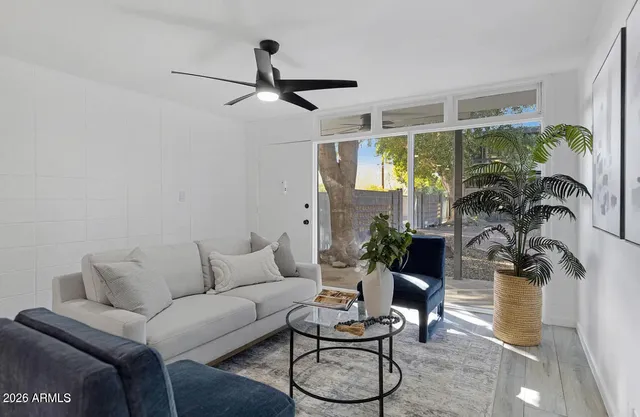 a living room with furniture and a large window