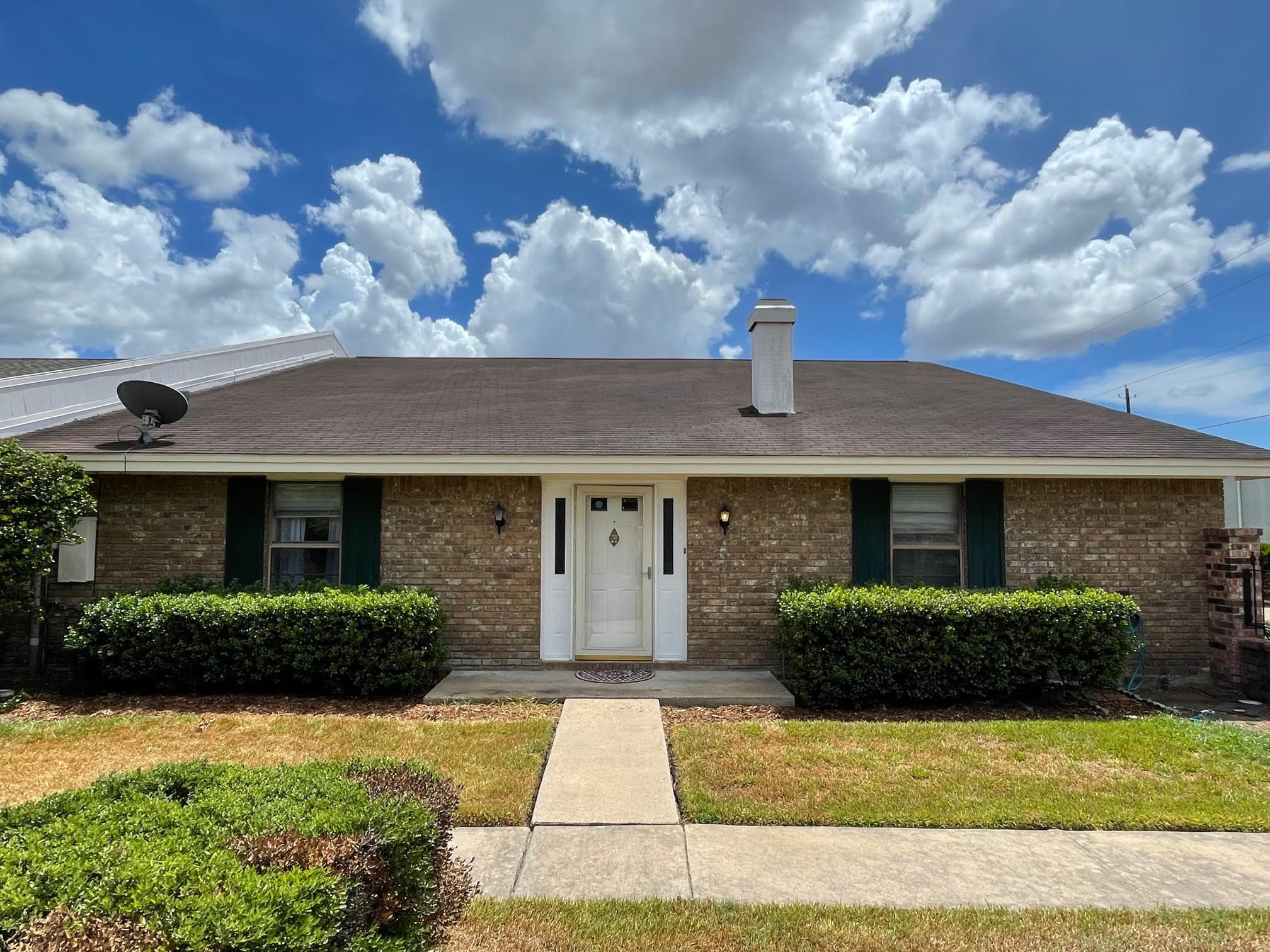 1732 Ave C, Unit A El Campo, TX 77437 - Photo 1 of 22 a front view of a house with garden