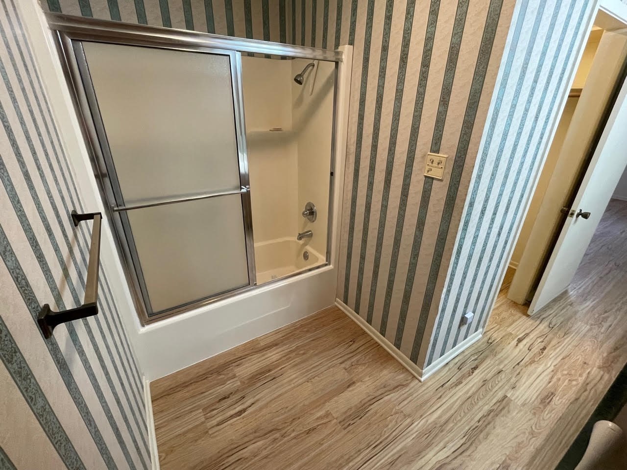 1732 Ave C, Unit A El Campo, TX 77437 - Photo 11 of 22 a view of a room with wooden floor and staircase