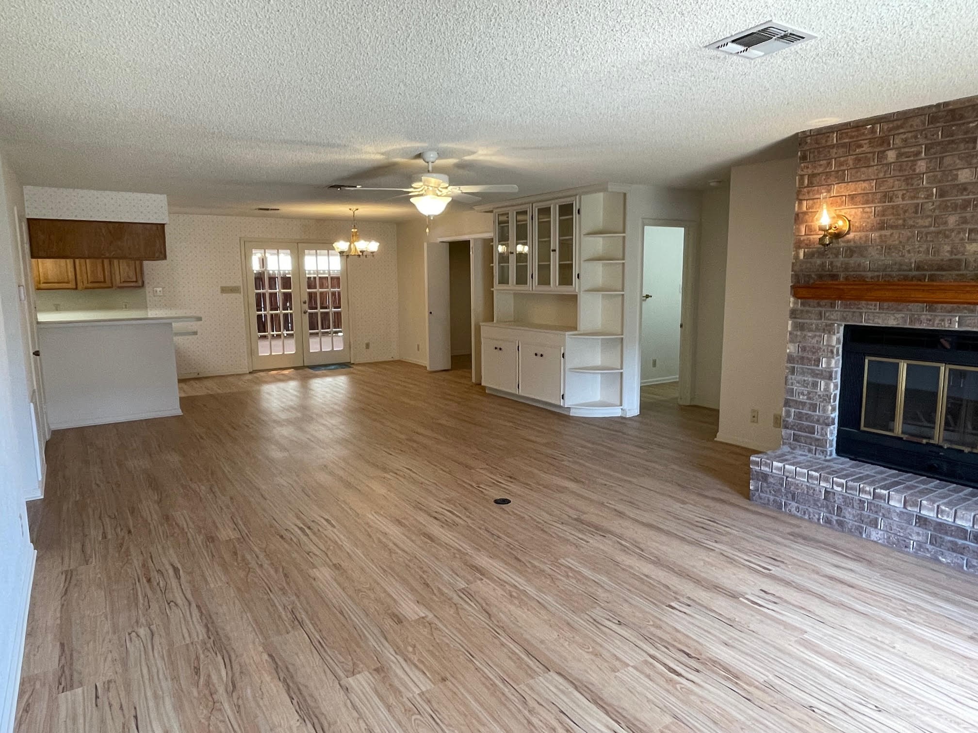 1732 Ave C, Unit A El Campo, TX 77437 - Photo 5 of 22 a view of a living room a fireplace with wooden floor