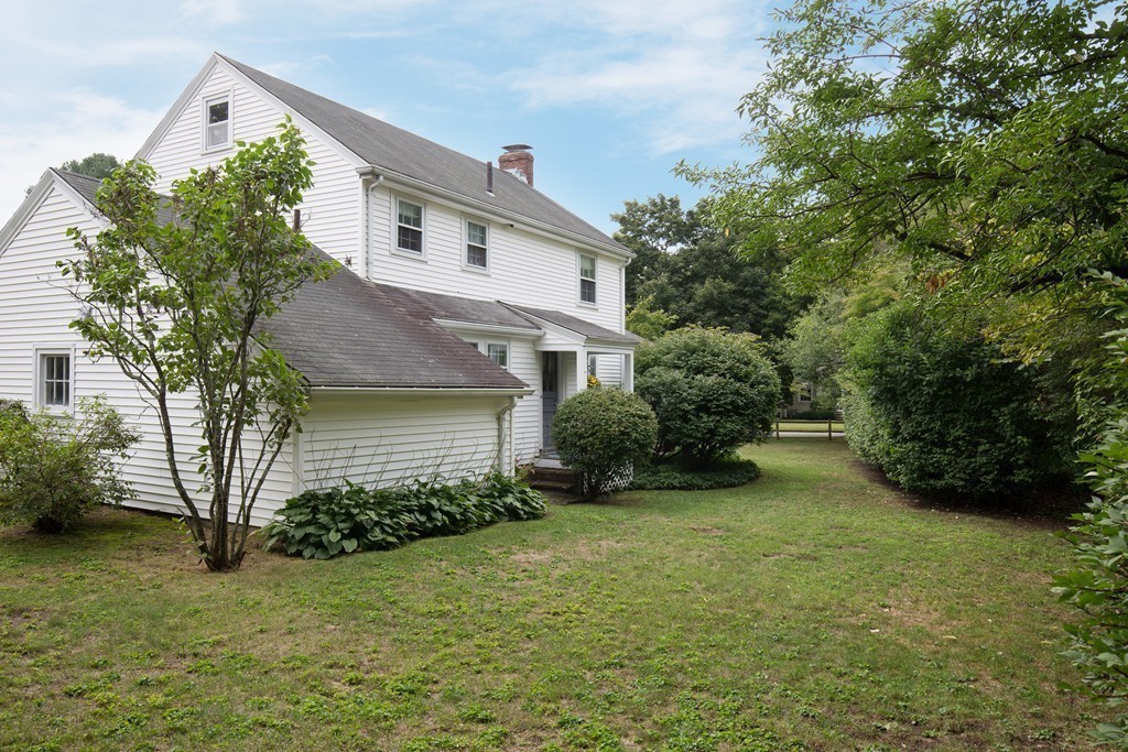 57 Fuller Brook Road Wellesley, MA 02482 - Photo 12 of 12 a front view of a house with garden