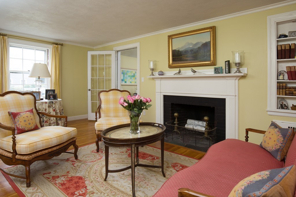 57 Fuller Brook Road Wellesley, MA 02482 - Photo 3 of 12 a living room with furniture and a fireplace