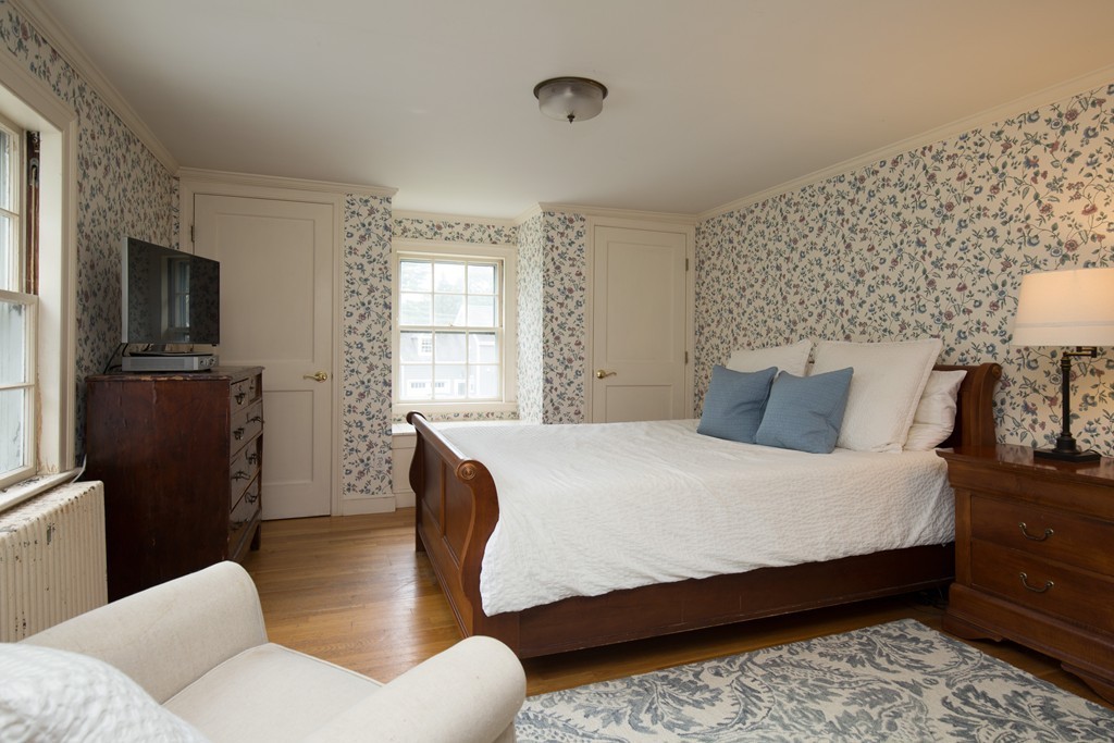 57 Fuller Brook Road Wellesley, MA 02482 - Photo 7 of 12 a bedroom with a bed and wooden floor