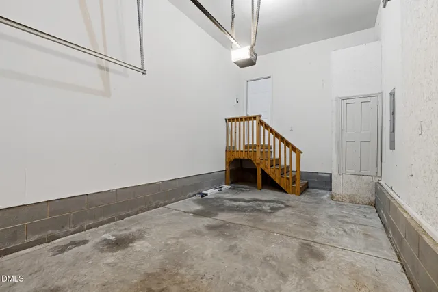 a view of an empty room with stairs