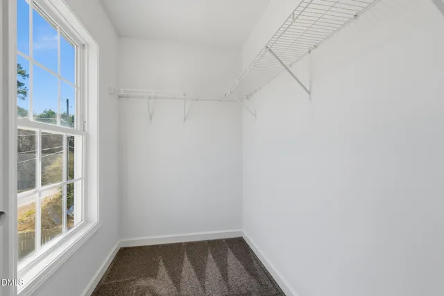 a view of a small space with racks on the wall