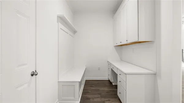 a view of a hallway with washer and dryer