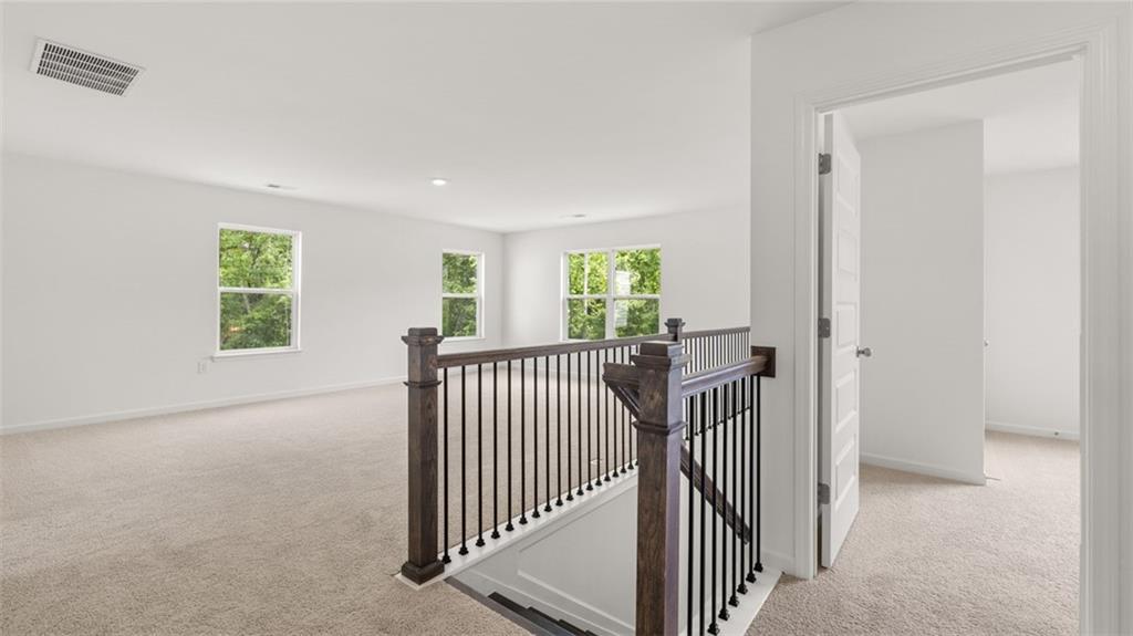 1775 Goodwin Drive Hampton, GA 30228 - Photo 20 of 49 a view of a hallway with windows and stairs
