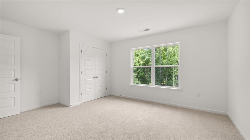 1775 Goodwin Drive Hampton, GA 30228 - Photo 31 of 49 an empty room with a window