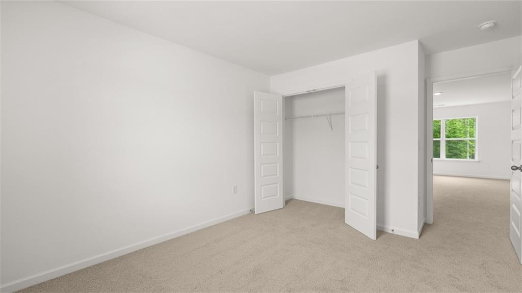 1775 Goodwin Drive Hampton, GA 30228 - Photo 33 of 49 an empty room with windows