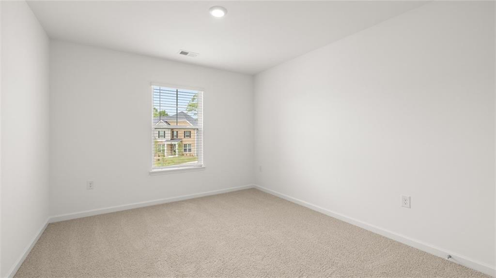 1775 Goodwin Drive Hampton, GA 30228 - Photo 35 of 49 an empty room with a window
