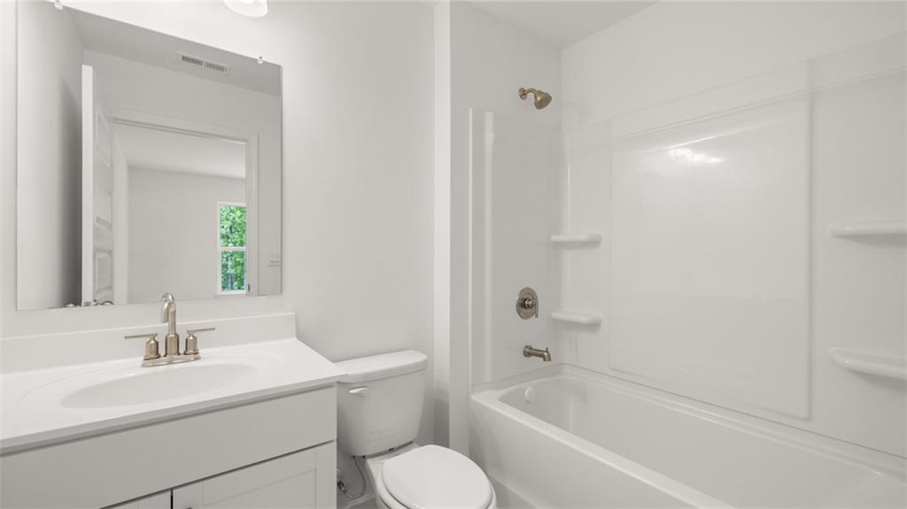 1775 Goodwin Drive Hampton, GA 30228 - Photo 36 of 49 a bathroom with a sink toilet and tub