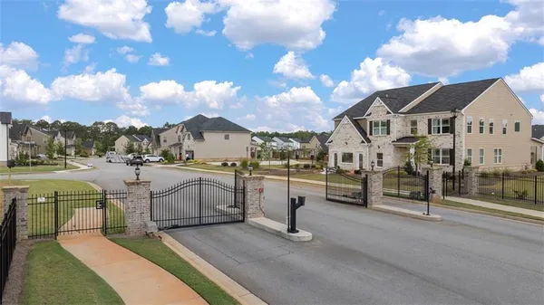 a view of multiple houses with a yard
