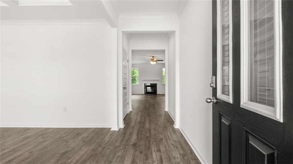 1775 Goodwin Drive Hampton, GA 30228 - Photo 5 of 49 a view of a hallway with wooden floor and staircase