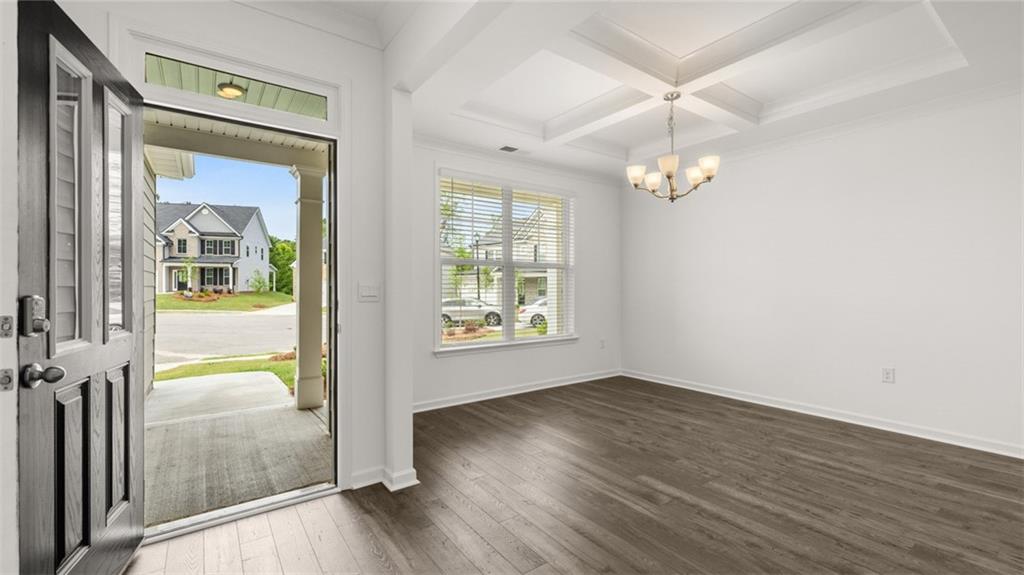 1775 Goodwin Drive Hampton, GA 30228 - Photo 6 of 49 wooden floor in an empty room with a window