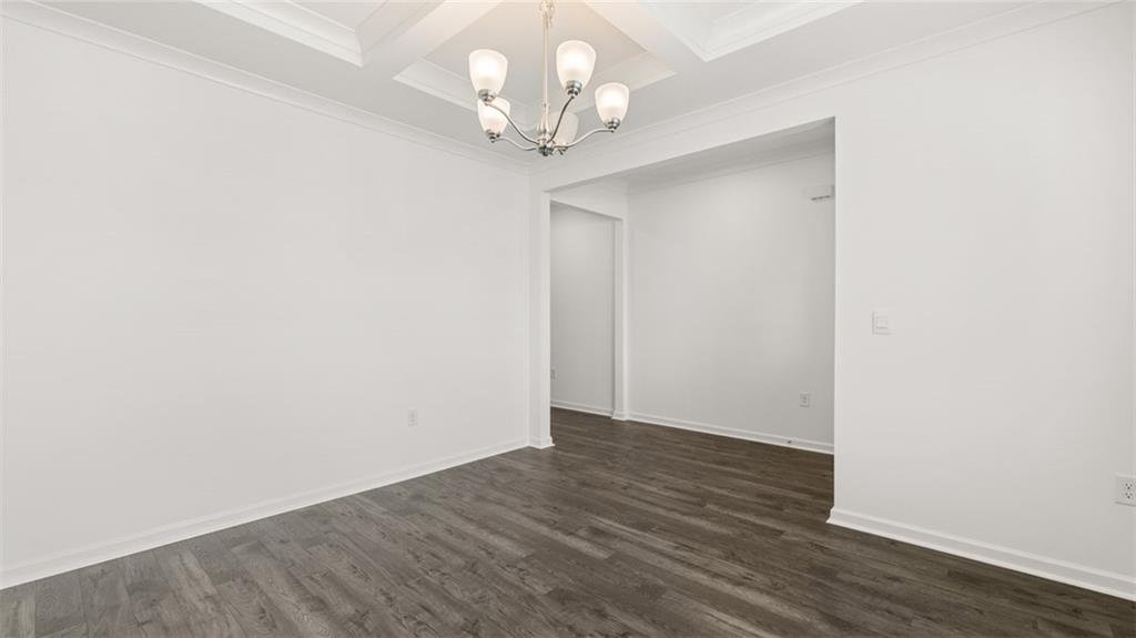 1775 Goodwin Drive Hampton, GA 30228 - Photo 7 of 49 a view of an empty room with wooden floor