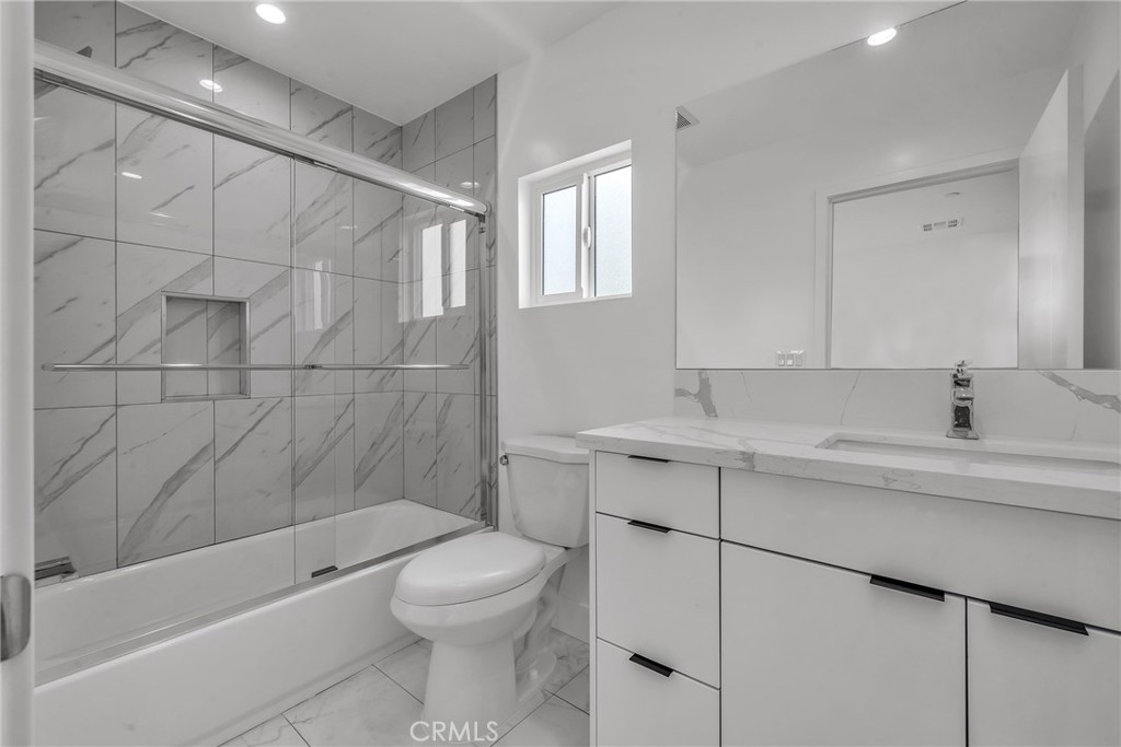 4453 Colfax Avenue, Unit 2 Studio City, CA 91602 - Photo 16 of 60 a bathroom with a sink a toilet and shower