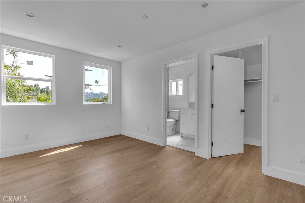 4453 Colfax Avenue, Unit 2 Studio City, CA 91602 - Photo 18 of 60 a view of an empty room with wooden floor and a window