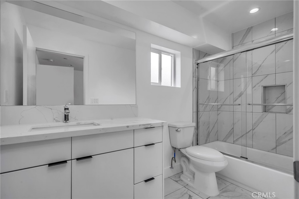 4453 Colfax Avenue, Unit 2 Studio City, CA 91602 - Photo 35 of 60 a bathroom with a sink toilet and shower