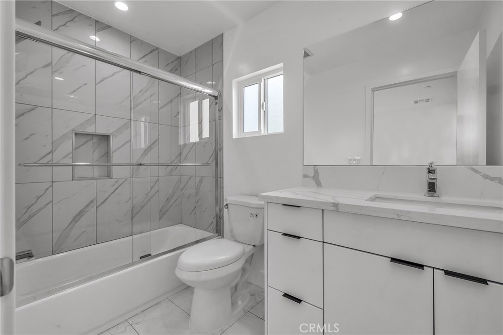 4453 Colfax Avenue, Unit 2 Studio City, CA 91602 - Photo 47 of 60 a bathroom with a sink a toilet and shower
