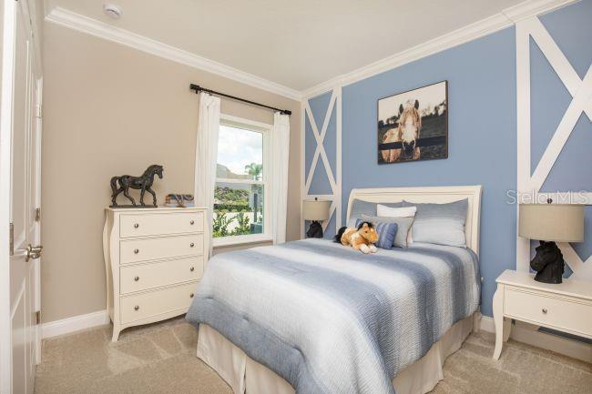 10 Fitzgerald Lane Palm Coast, FL 32137 - Photo 12 of 19 a bedroom with a bed and a window