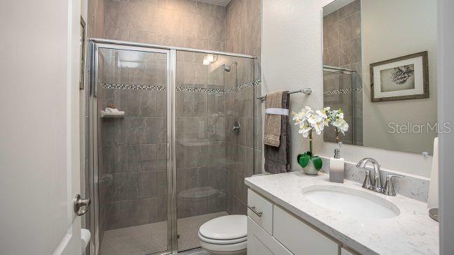 10 Fitzgerald Lane Palm Coast, FL 32137 - Photo 13 of 19 a bathroom with a granite countertop sink toilet and shower