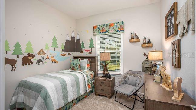 10 Fitzgerald Lane Palm Coast, FL 32137 - Photo 16 of 19 a bedroom with a bed and a couch