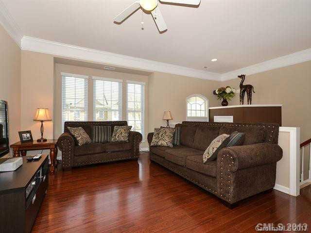 809 Granby Drive, Unit 38 Fort Mill, SC 29708 - Photo 2 of 15 a living room with furniture and a wooden floor