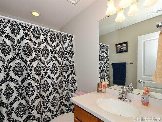 809 Granby Drive, Unit 38 Fort Mill, SC 29708 - Photo 11 of 15 a bathroom with a sink and a mirror