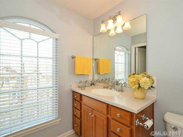 809 Granby Drive, Unit 38 Fort Mill, SC 29708 - Photo 13 of 15 a bathroom with a sink vanity and a mirror
