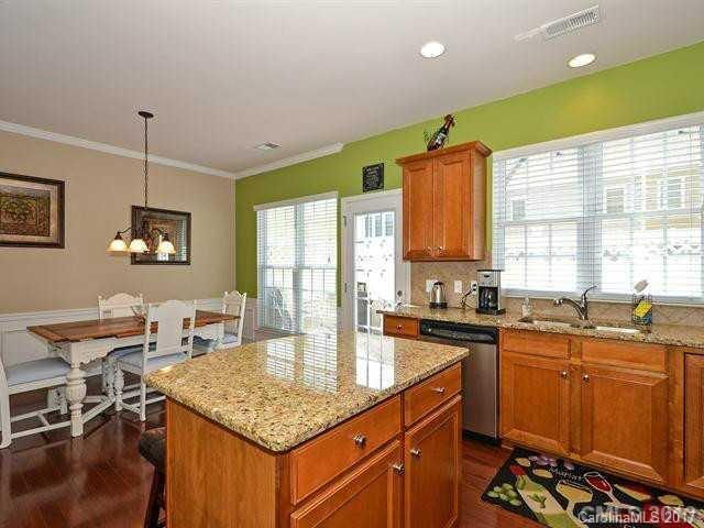 809 Granby Drive, Unit 38 Fort Mill, SC 29708 - Photo 4 of 15 a kitchen with stainless steel appliances granite countertop sink stove top oven and cabinets