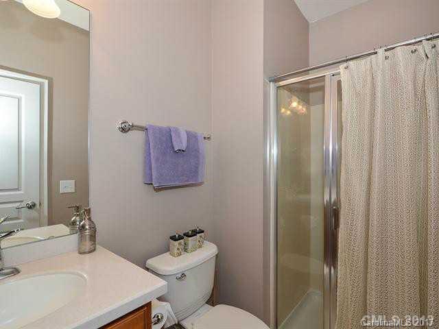 809 Granby Drive, Unit 38 Fort Mill, SC 29708 - Photo 9 of 15 a bathroom with a sink mirror and toilet