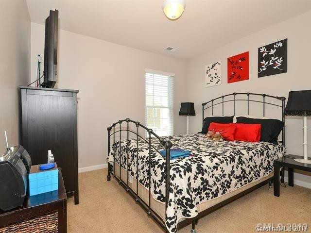 809 Granby Drive, Unit 38 Fort Mill, SC 29708 - Photo 10 of 15 a bedroom with bed and window