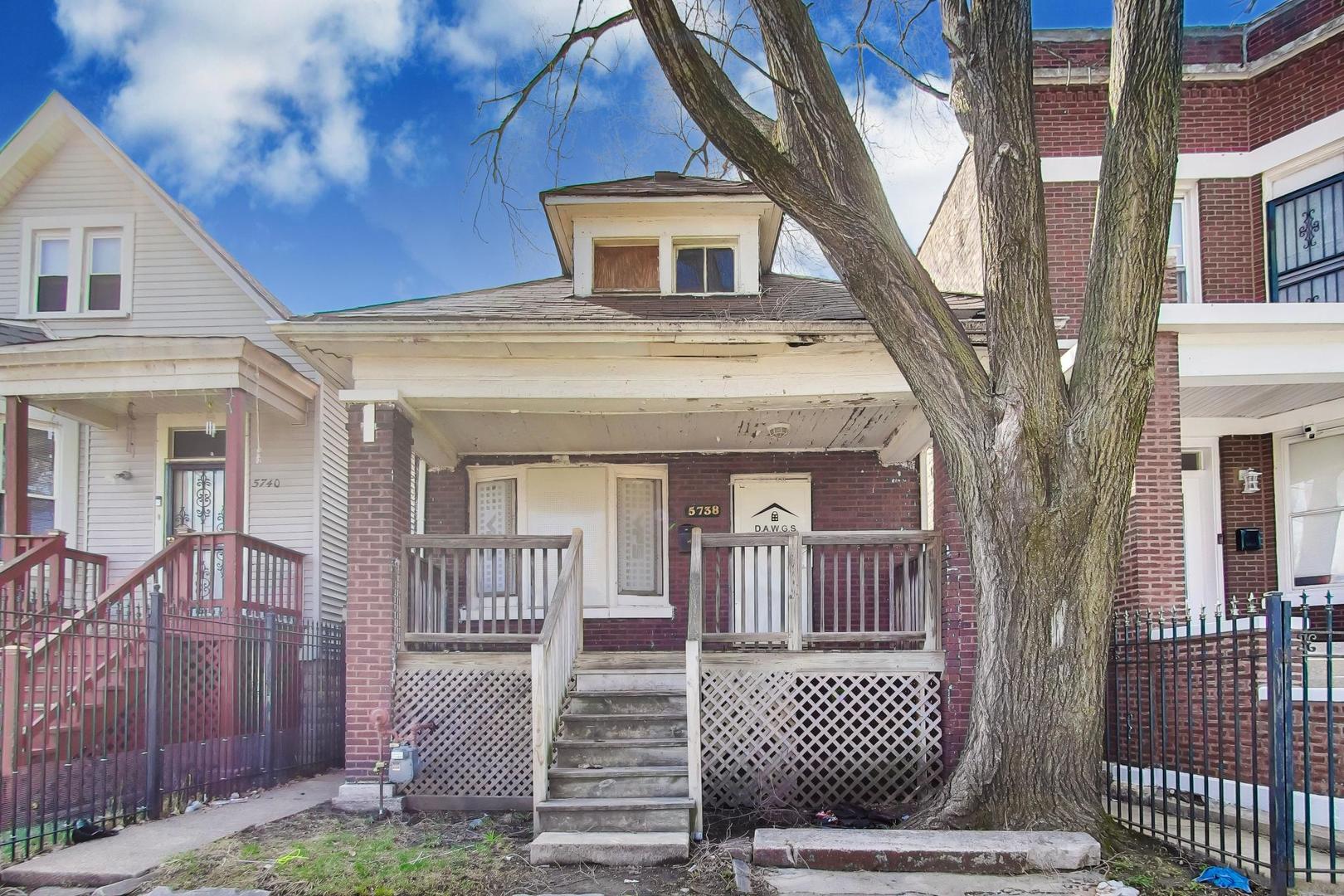 5738 South Ada Street Chicago, IL 60636 - Photo 1 of 22 a front view of a house with garage