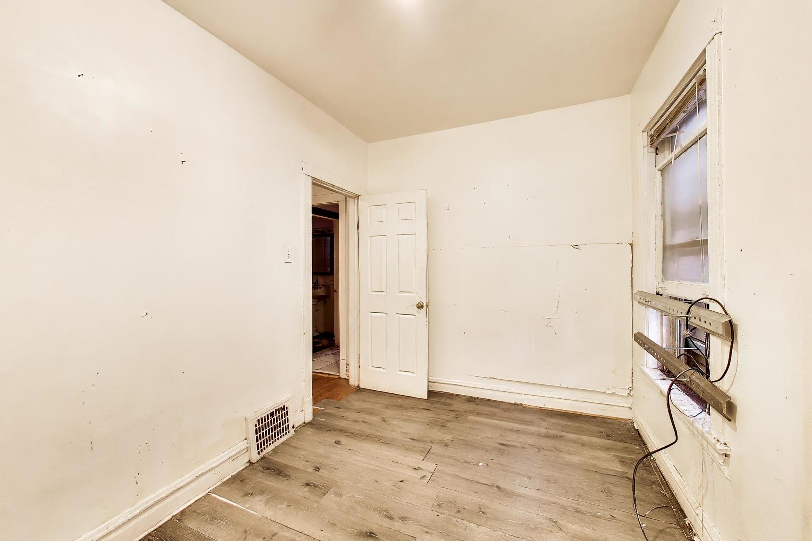 5738 South Ada Street Chicago, IL 60636 - Photo 15 of 22 a view of a storage & utility room with window