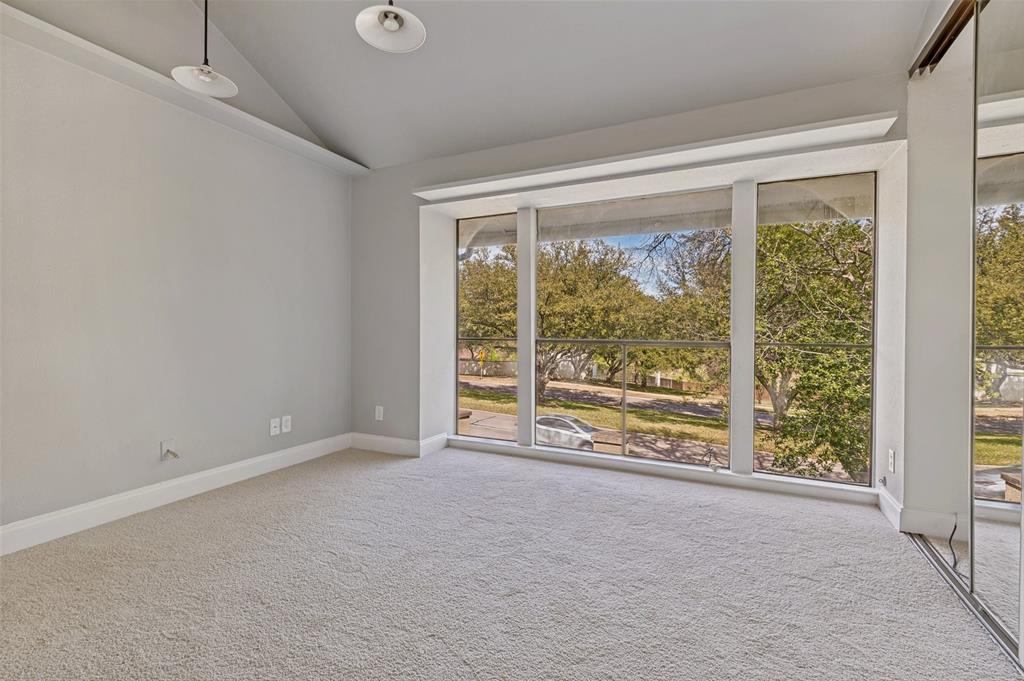 4505 North O'Connor Road, Unit 1121 Irving, TX 75062 - Photo 20 of 34 an empty room with wooden floor and a large window