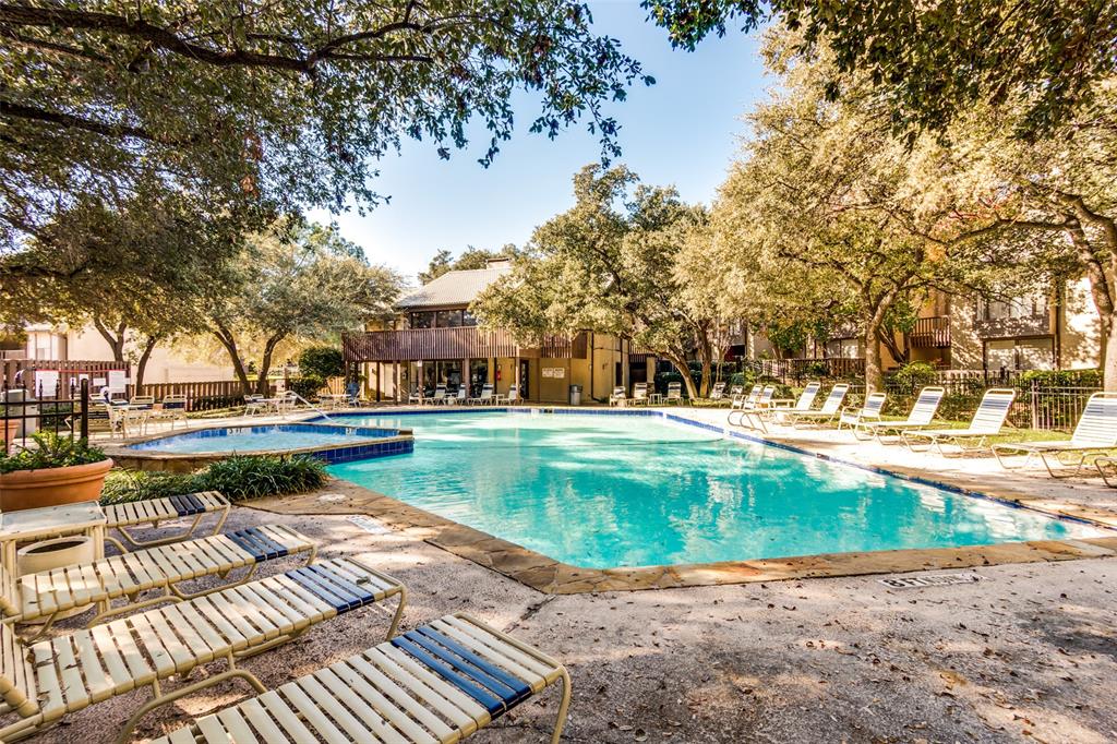 4505 North O'Connor Road, Unit 1121 Irving, TX 75062 - Photo 31 of 34 a view of swimming pool with outdoor seating and lake view